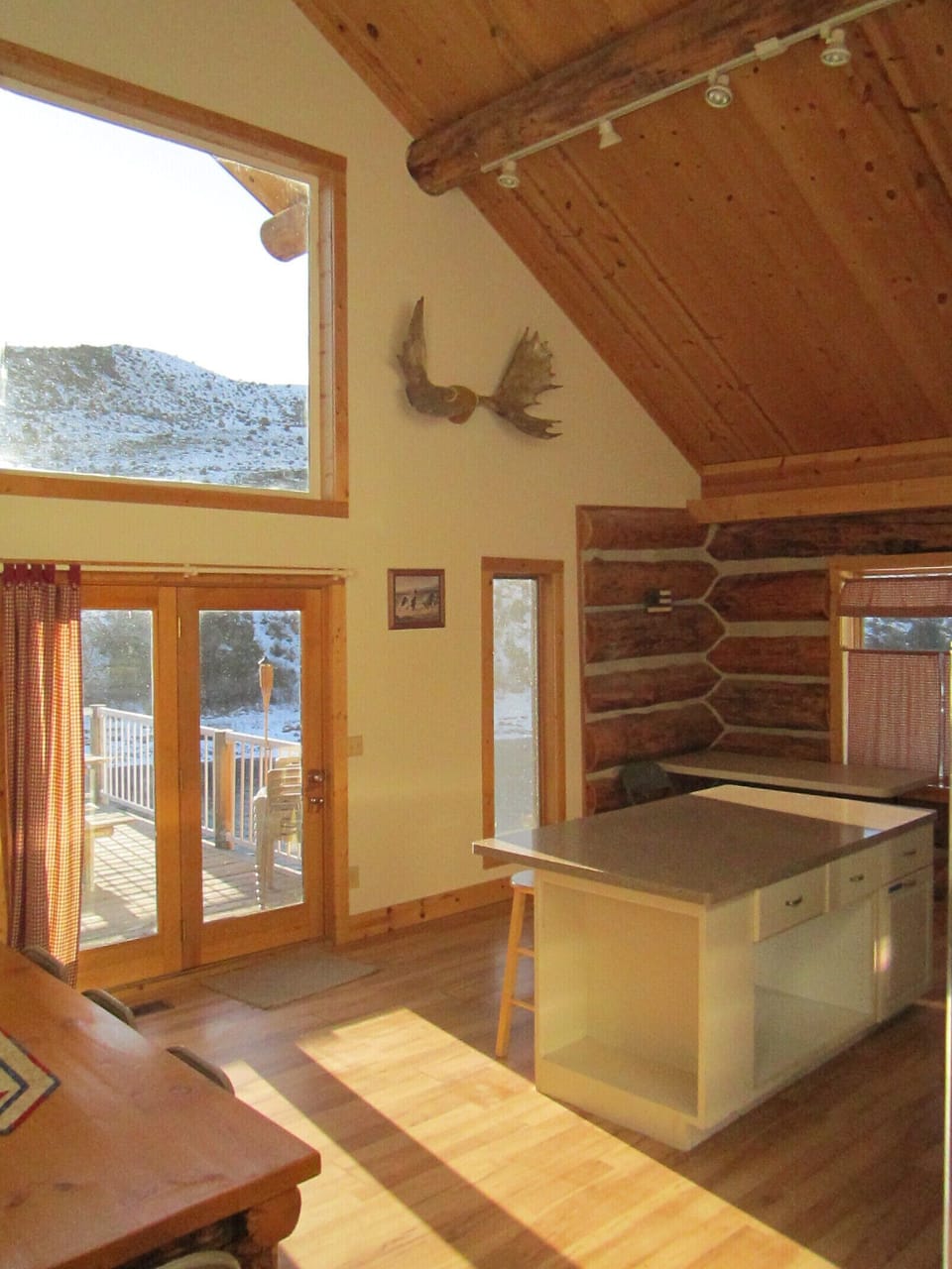 Kitchen island with door to the deck overlooking the Yellowstone River
