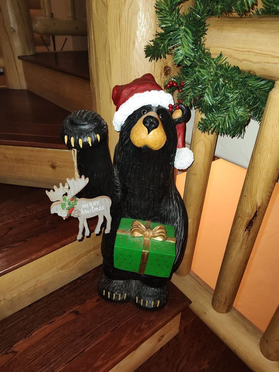 The Christmas bear invites you upstairs to the primary suite and office space.
