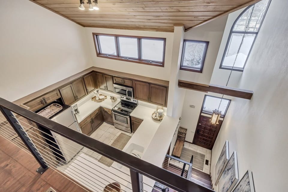 View from loft down to kitchen and entryway.
