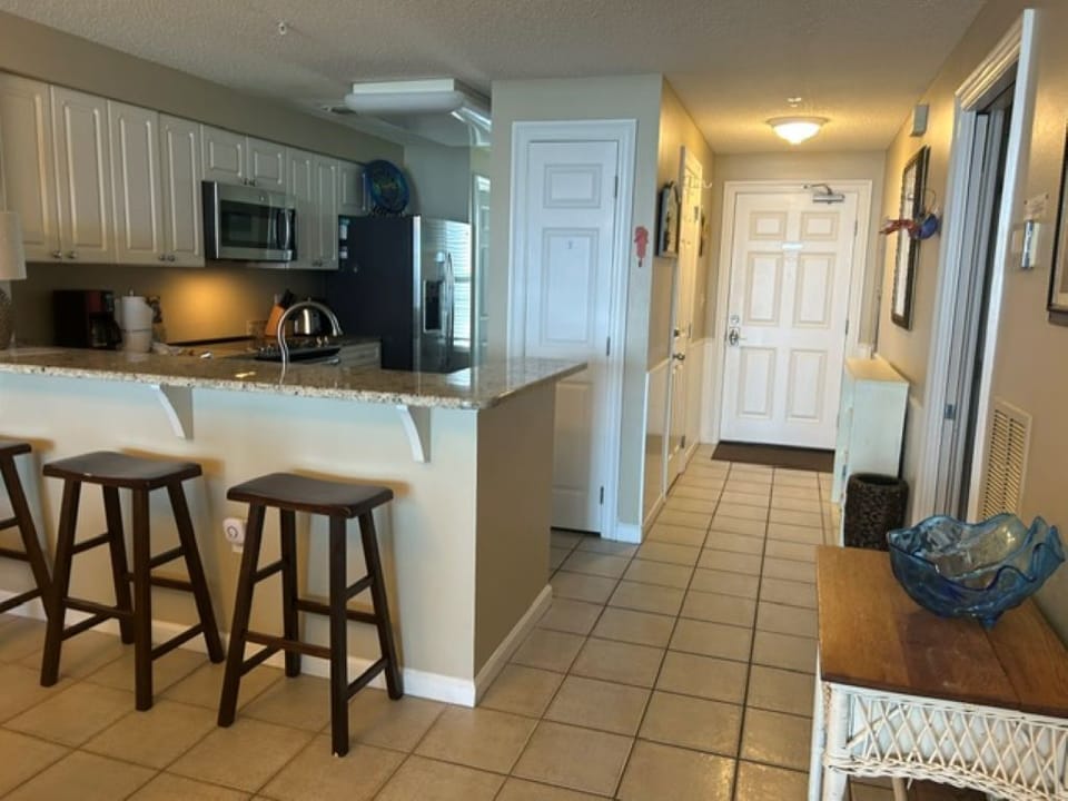 kitchen with breakfast bar and entrance