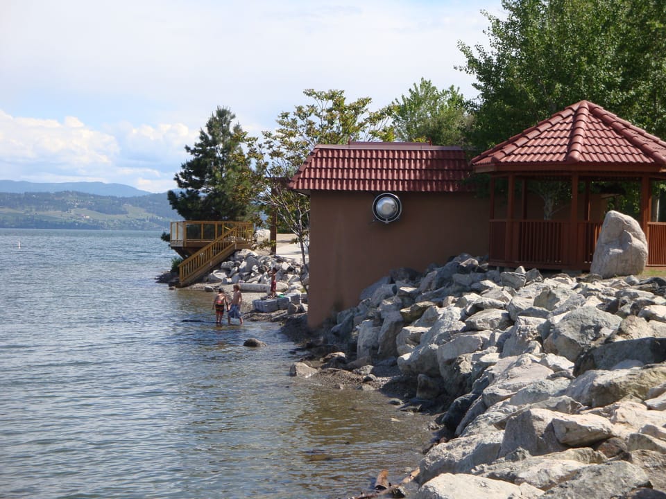 Swimming area and beach front at the lake. 