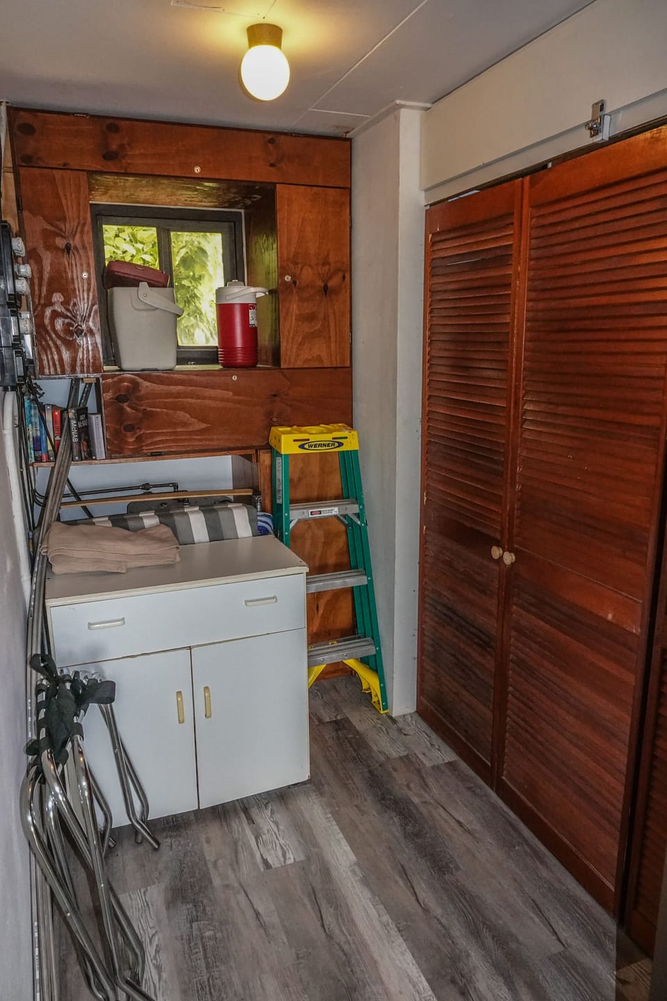 Storage room and clothes closet beside bedroom