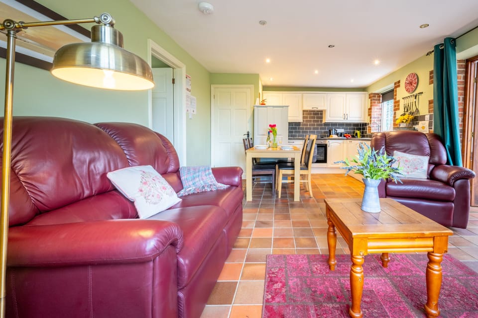Badger's Den, Heacham: The sitting room leading to dining area and kitchen