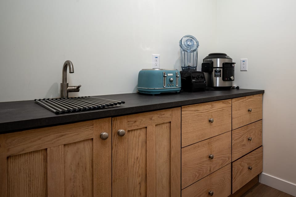Butlers pantry w/ sink for prep and appliances. 