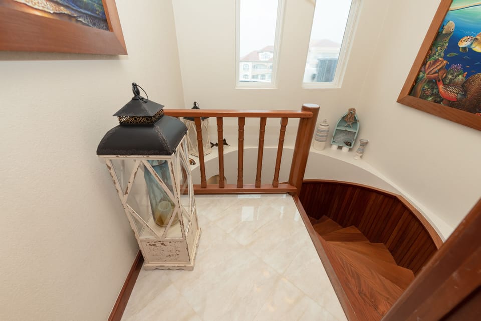 Winding stairs down from master bedroom