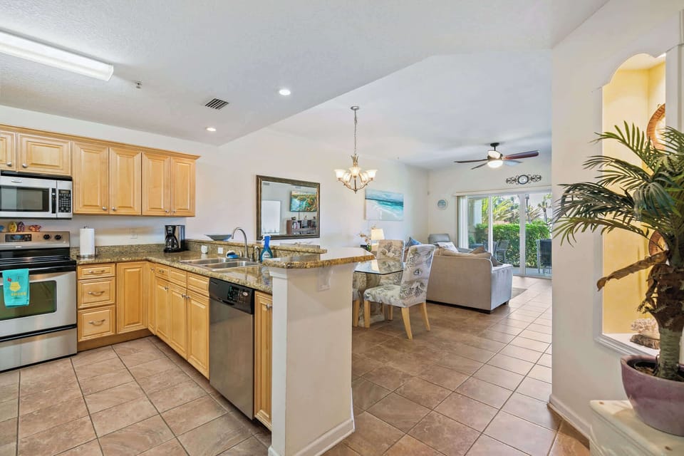 - Kitchen with stainless steel appliances and spacious countertops  
- Open-plan design connects to the living room for easy gatherings  
- Fully stocked for cooking and dining during your coastal vacation  