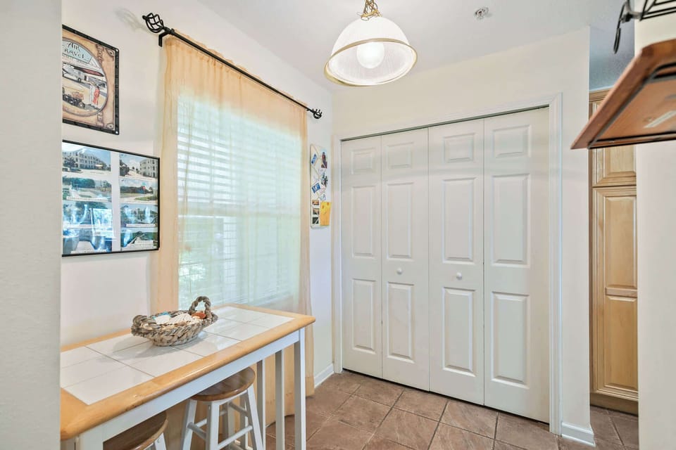 - Bright and cheerful dining nook styled with neutral accents  
- Window fills space with natural light for a welcoming vibe  
- Perfect corner for enjoying casual breakfasts or quick snacks 