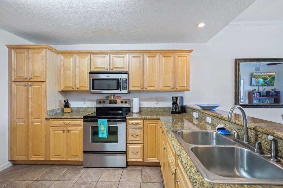 - Fully stocked kitchen with microwave, oven, and ample storage  
- Stainless steel appliances and granite counters add comfort  
- Ideal for preparing meals in your vacation rental with ease 