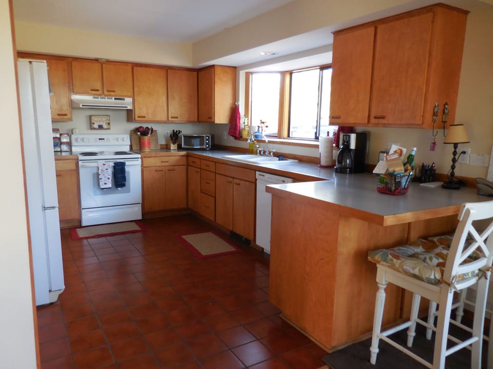 Spacious kitchen with a view window.