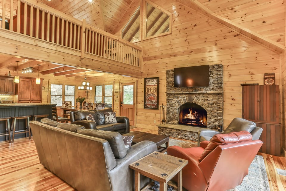 Handcrafted Pine interior open floor plan connects kitchen, dining & living area