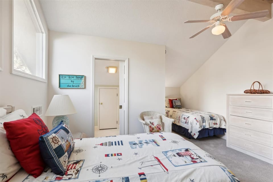 Upstairs Guest Room with Four Twin Beds at 14 Green Heron