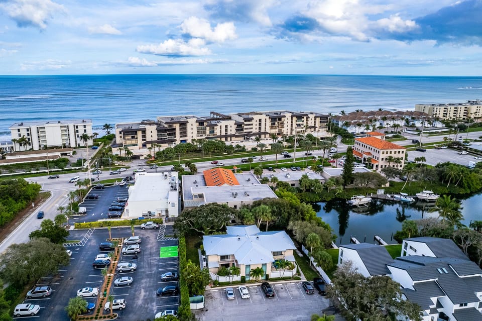 Drone footage showing shops and beach 1 block away