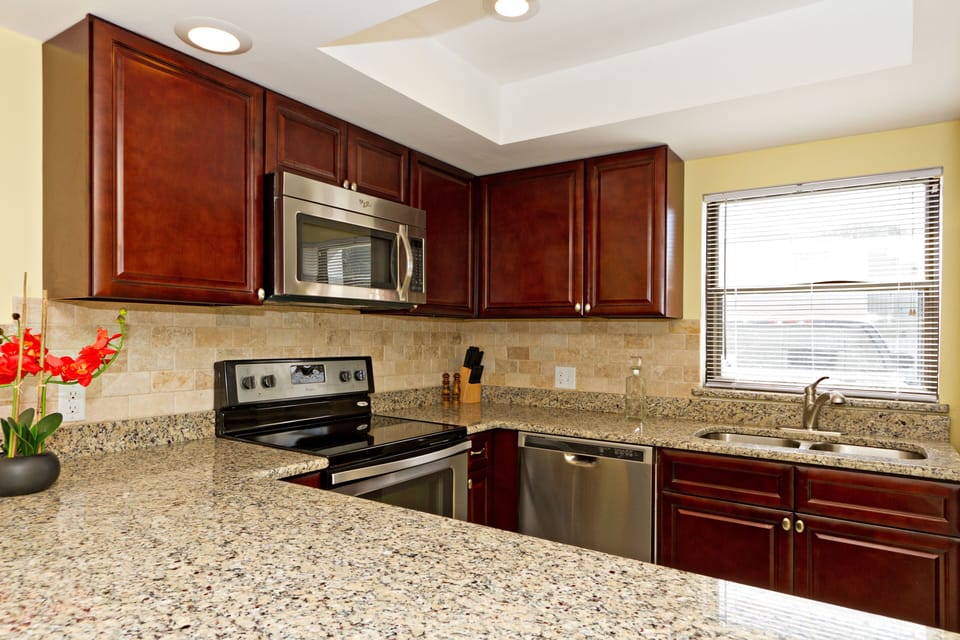Renovated kitchen with wood cabinets, granite, stainless steel appliances