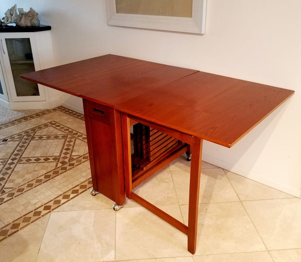 Folding dining room table in hallway.  This table is large and seats 4 people