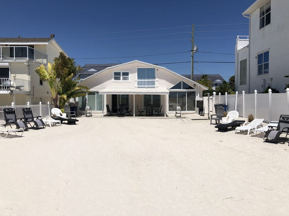 Back yard onto beach of Duplex,  North side is on left in picture.