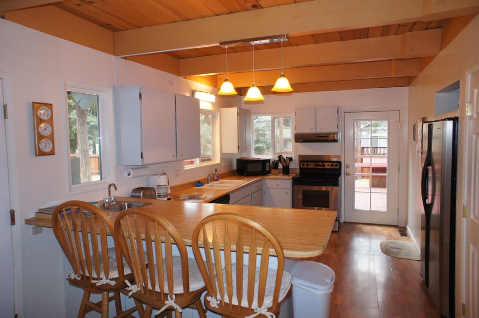 Kitchen with dishwasher, stainless steal appliances, fridge with water & ice