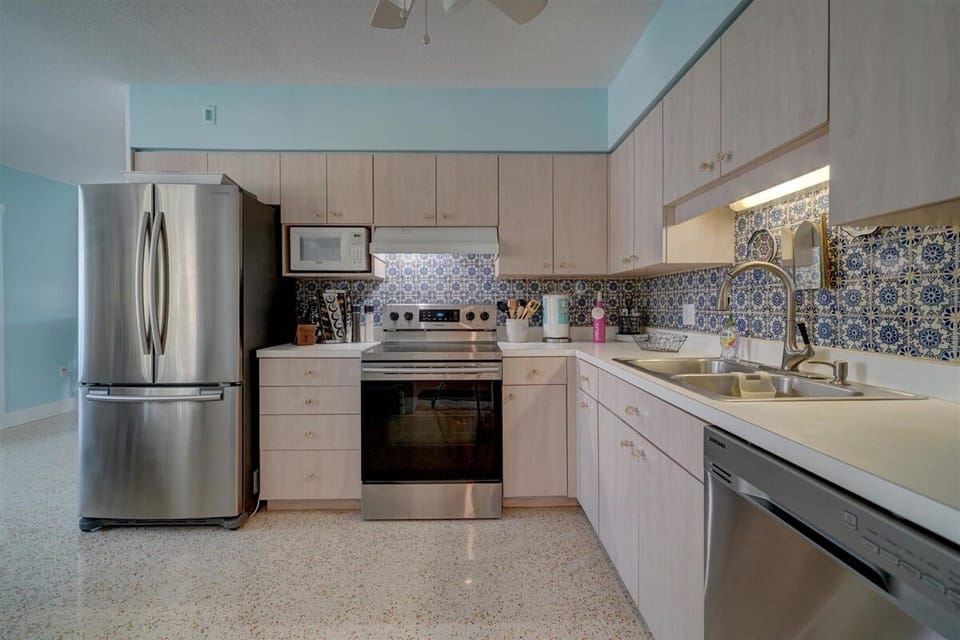 From mud room, walk into the kitchen & everything you could need - even spices!