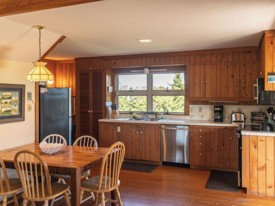 Kitchen and Dining Area with Deck Access, Second Floor