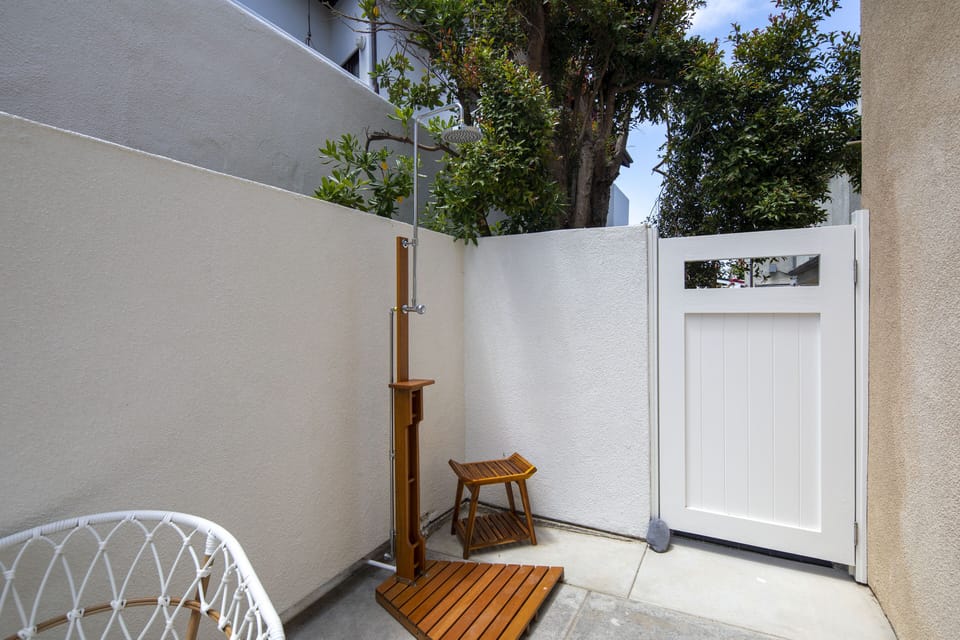 Outdoor shower perfect when coming home from your day at the beach!