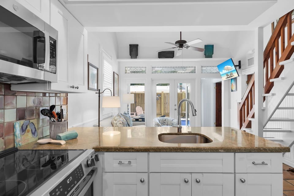 Peninsula with sink, storage, and seating