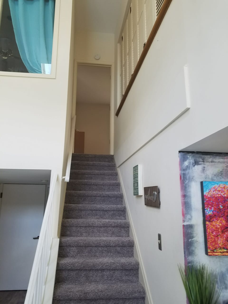 stairs leading up to The bedroom and sitting area with jacuzzi and full bathroom