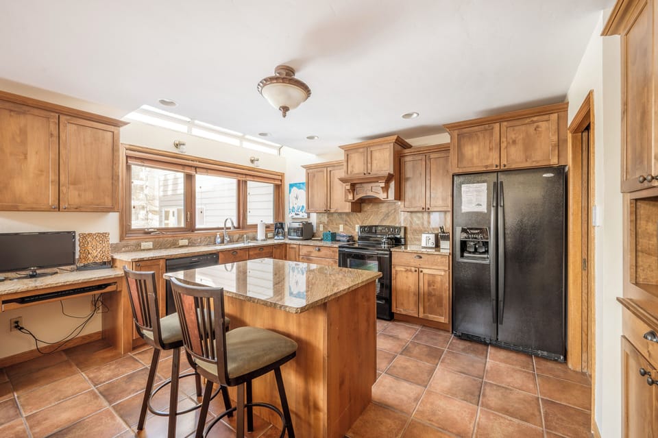 Kitchen - Open kitchen with seating for 2 people