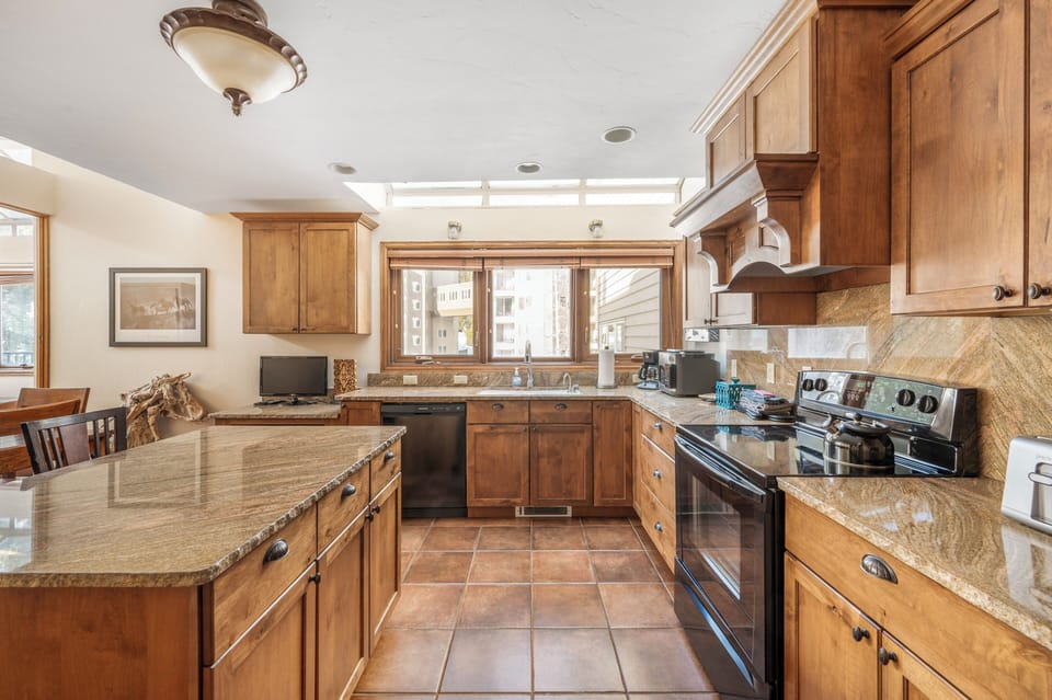 Kitchen - Open kitvhen with granite counter top and all the appliances you need
