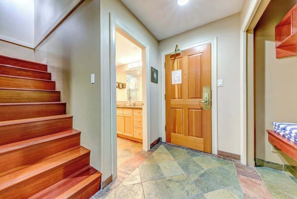 Stairs to loft and entrance to second bathroom