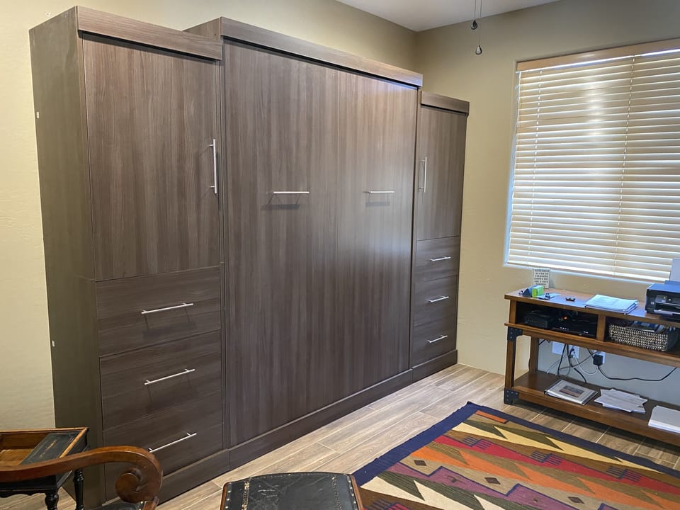 Third bedroom queen murphy bed, office area, flat screen tv, access to shower