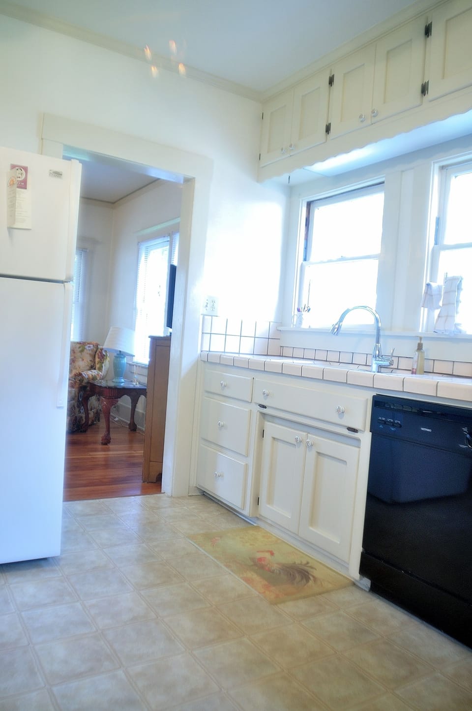 Walking out of the kitchen into the living room