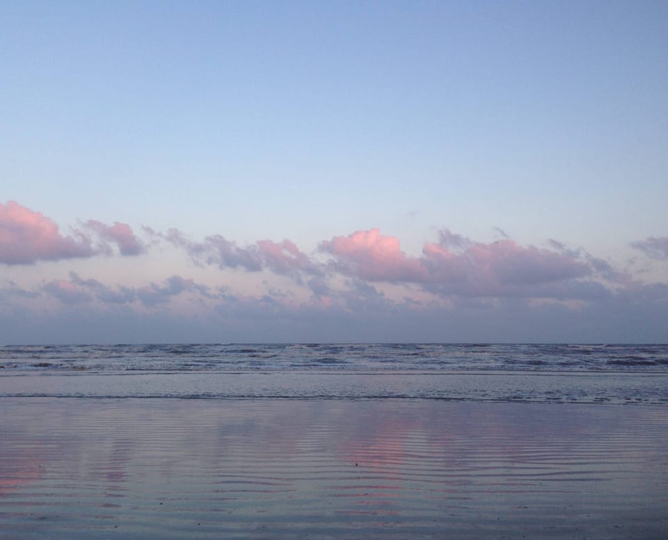 The beautiful colors as the sun sets in the background