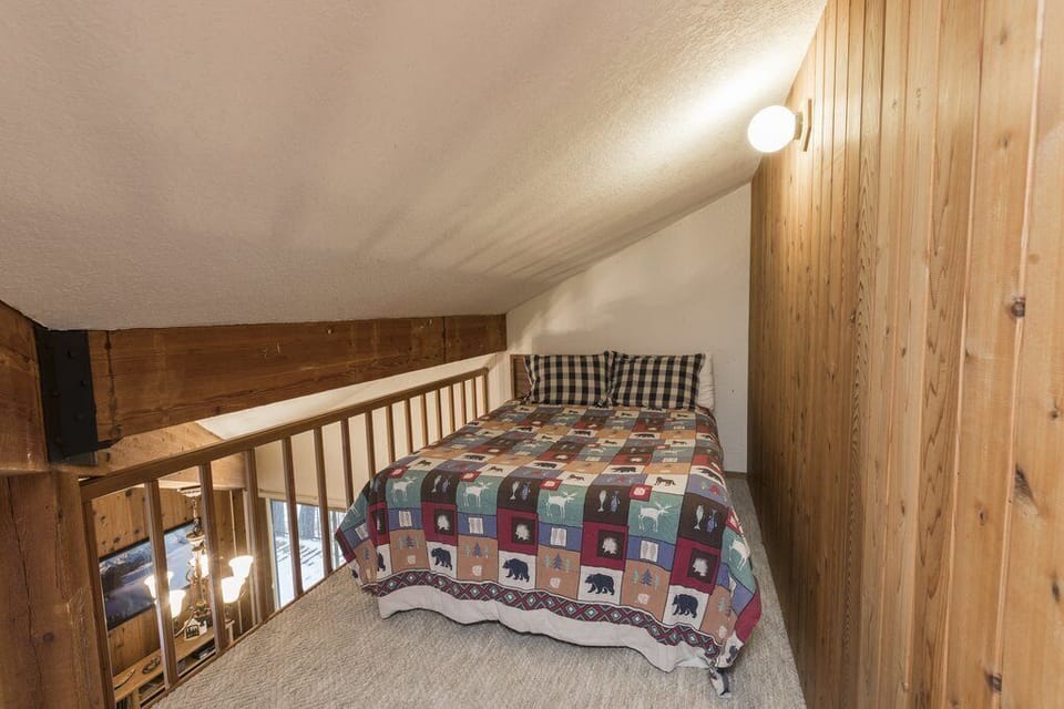 Queen bed in the loft.