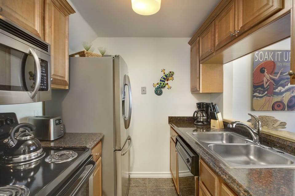 Updated kitchen with stainless steel appliances.