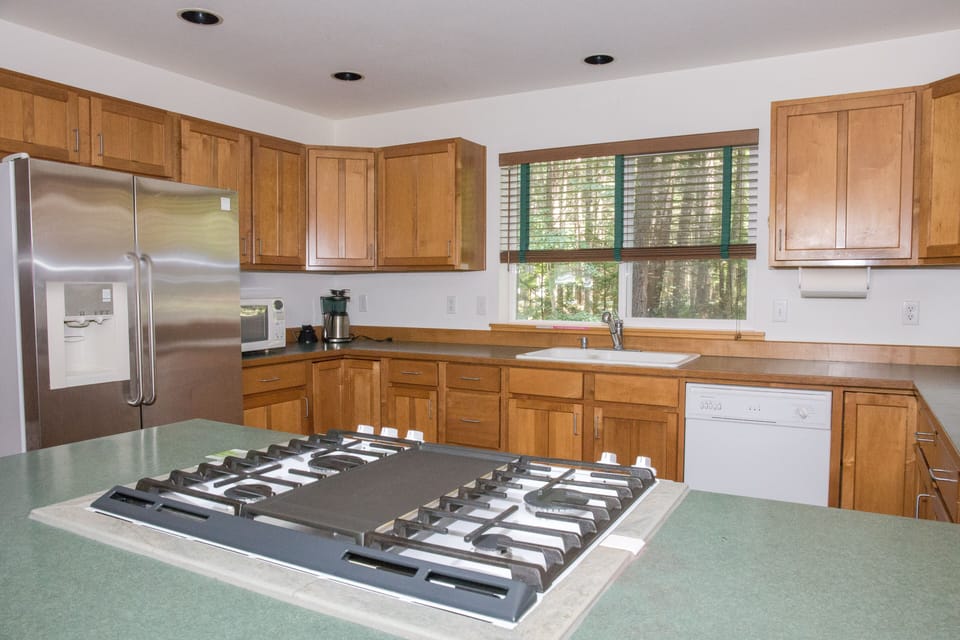 Spacious kitchen with brand new gas range and oven