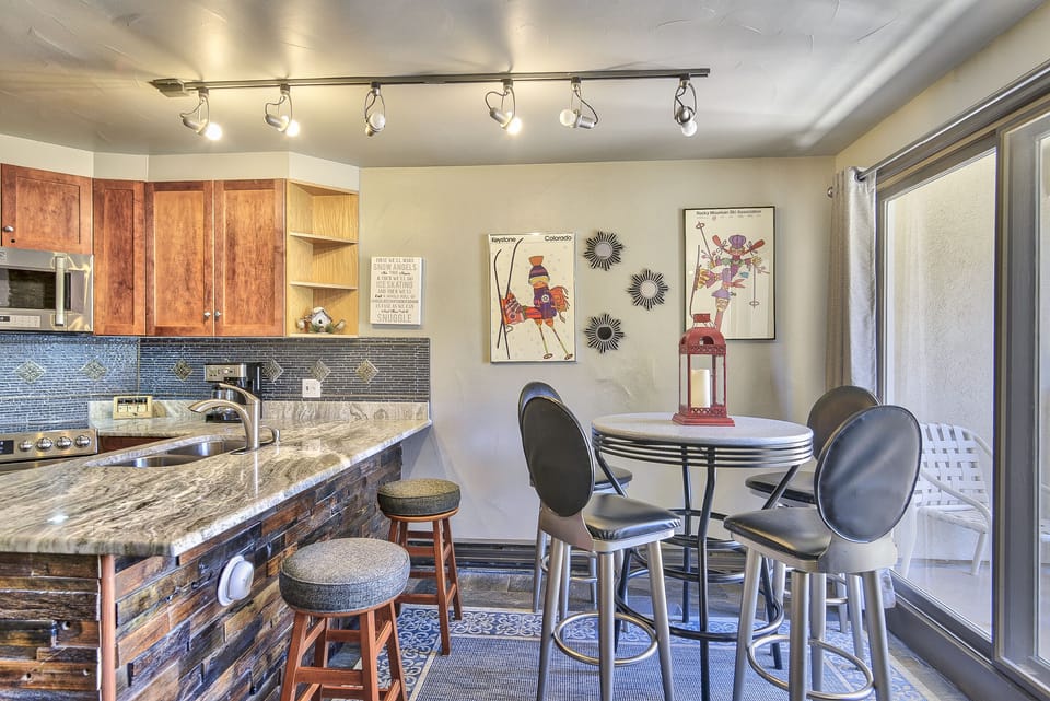 Dining Area - Modern counter-height table with seating for four.