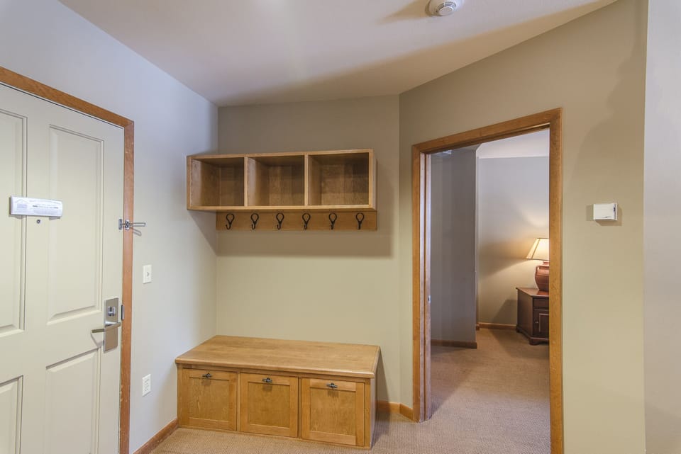 Entry Way - Complete with storage cubbies above and below, as well as coat hooks