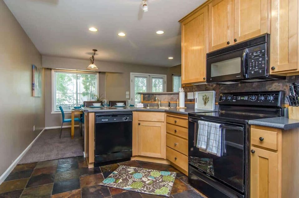Beautiful fully stocked kitchen with appliances and utensils