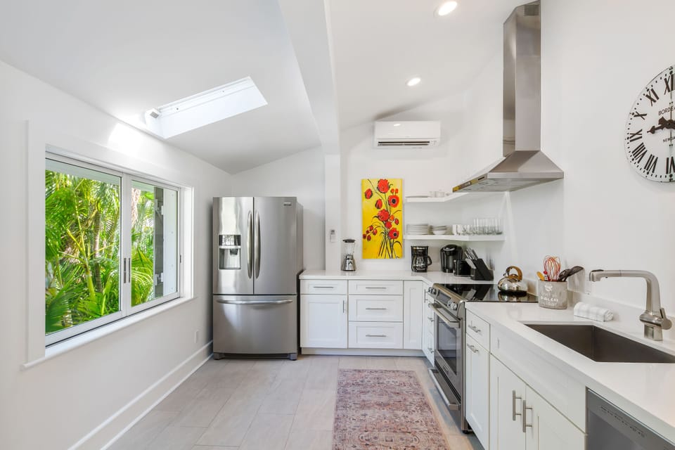 Modern kitchen with stainless steel appliances.