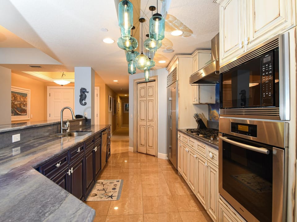 Full kitchen with modern appliances.