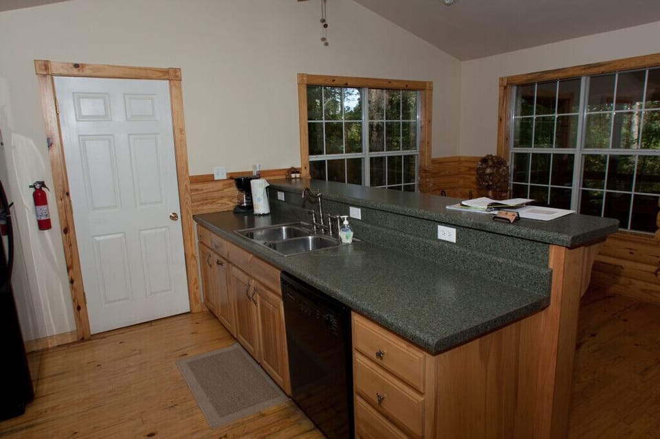 Fully stocked kitchen with refrigerator, stove, and dishwasher