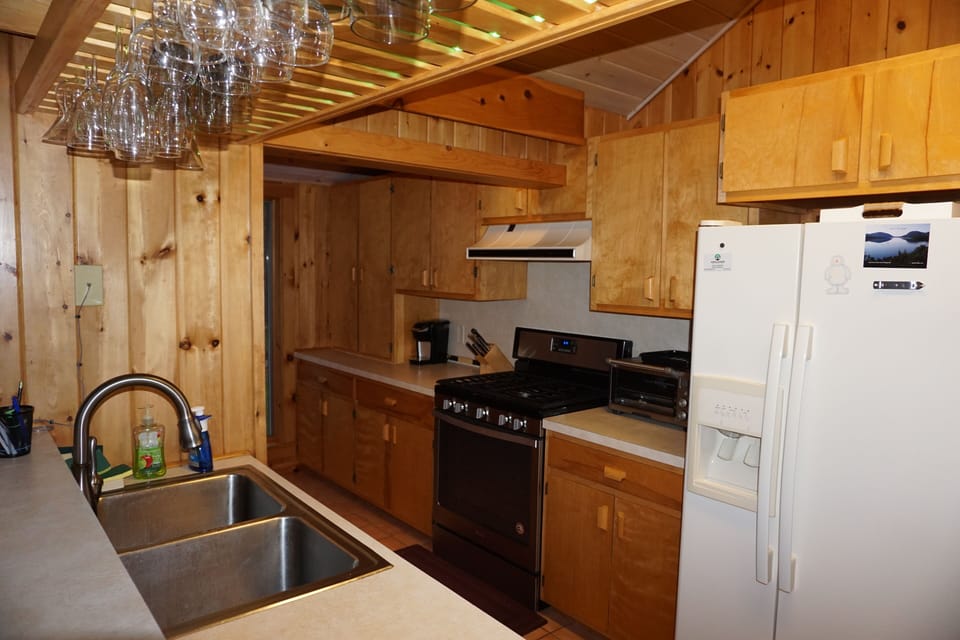 The fully stocked efficiently laid out kitchen  is open to the living area