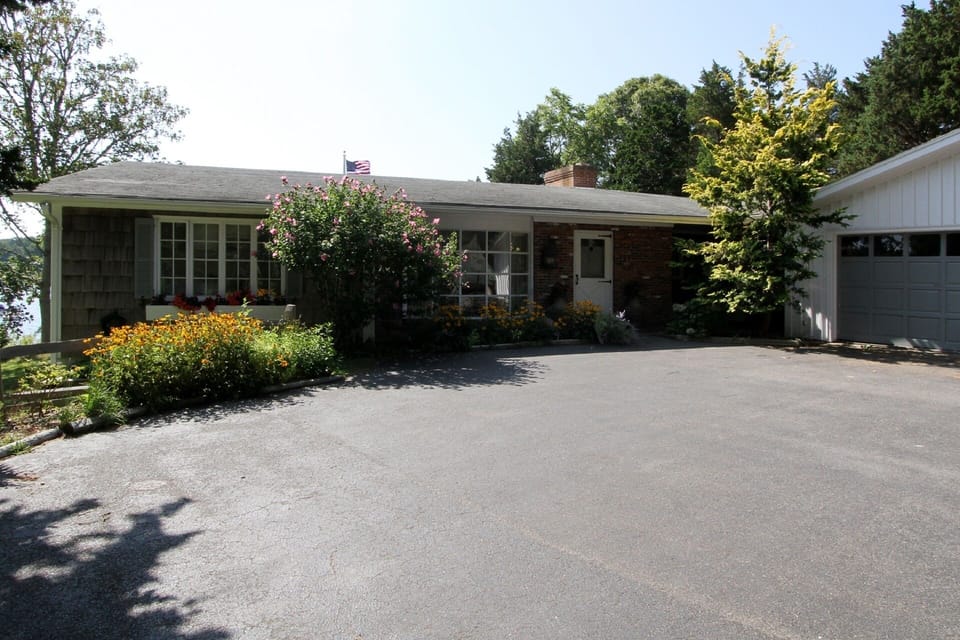 Front view of house with long private driveway