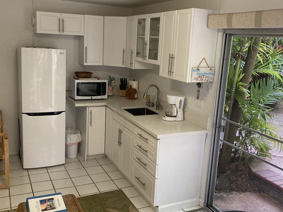 Palm Villa kitchen overlooking the pool and garden area