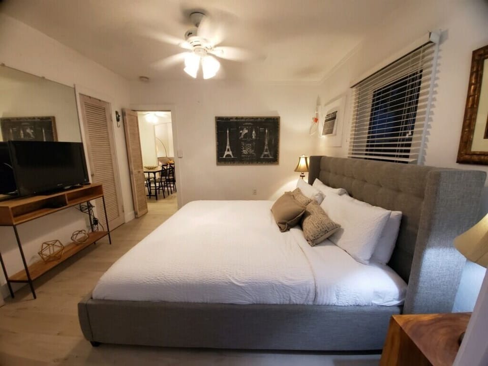 The King bedroom is spacious and has updated bedding.