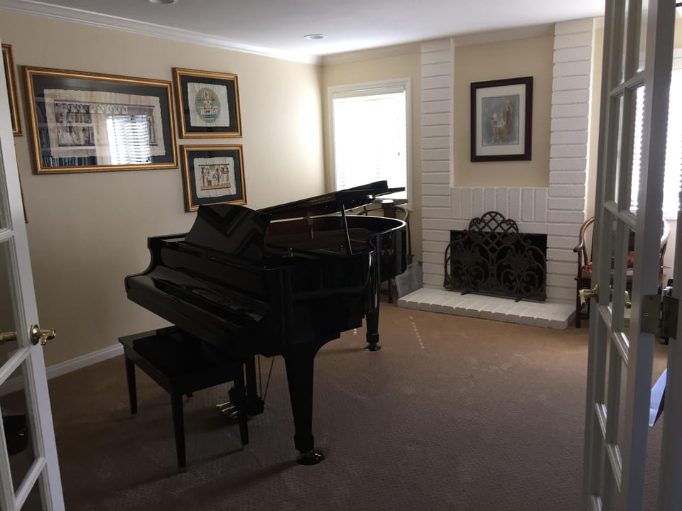 Music-Library with Baby Grand piano .