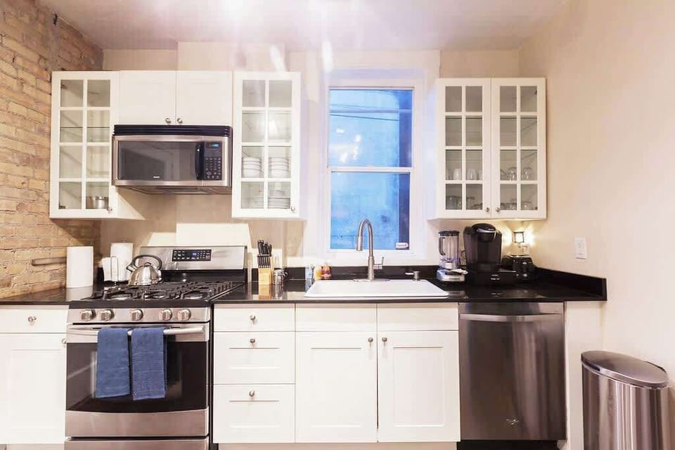 Bright and functional kitchen with stainless steel appliances and plenty of space for cooking and meal prep. 🍳✨