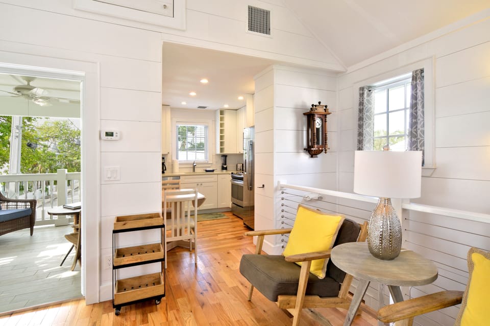 View of balcony access to the left and kitchen to the right.