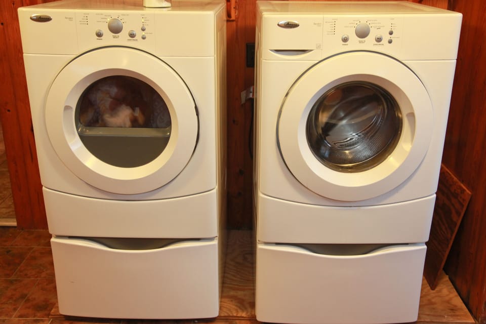 Has a large laundry room that is great for storing suitcases and coolers!