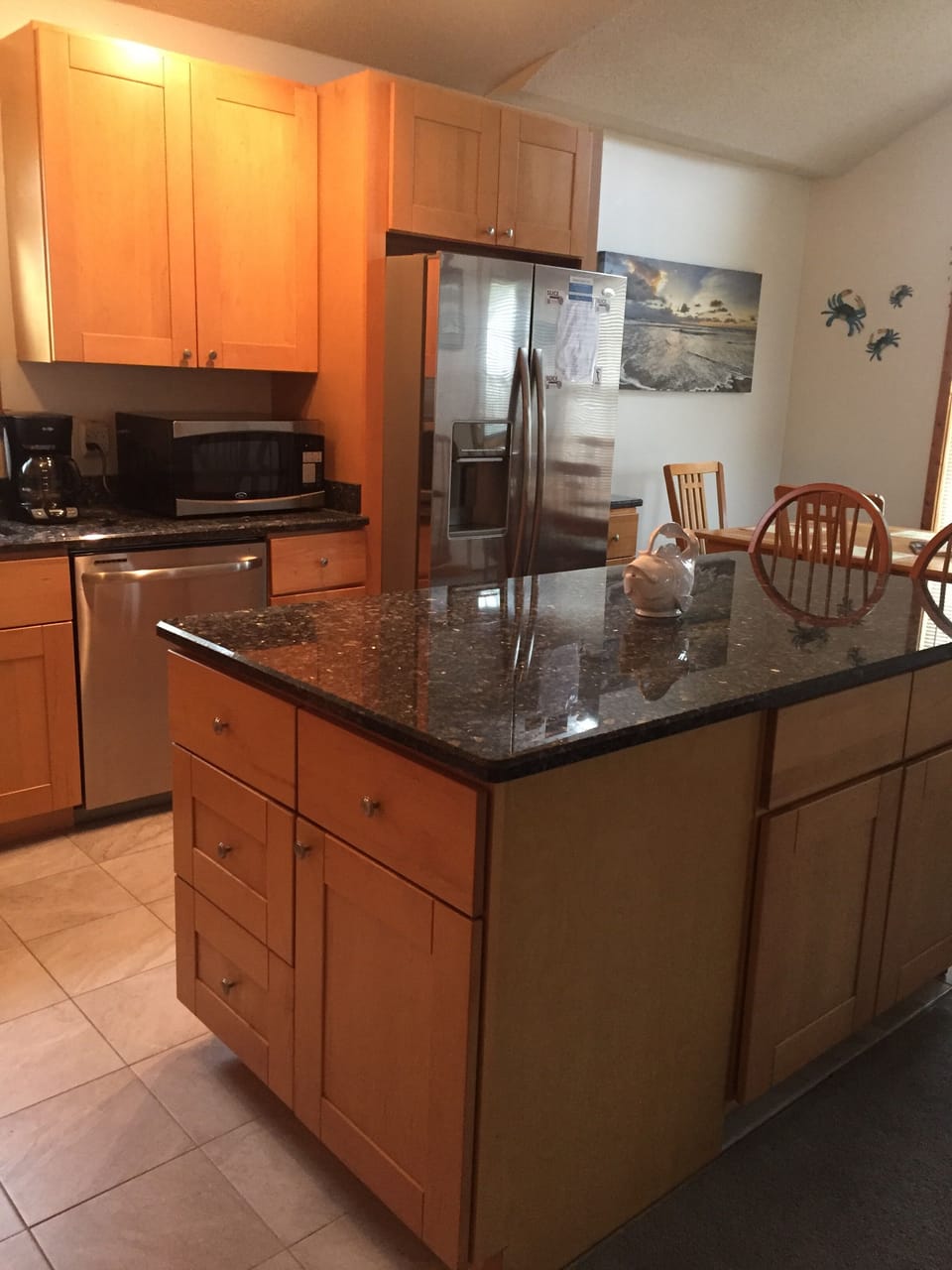 Second level Updated kitchen has Fire extinguisher on counter and fire blanket