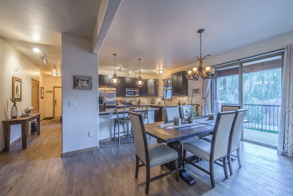 Dining Area - Dining Area-
Large dining table with seating for six guests. Additional seating at the kitchen counter.